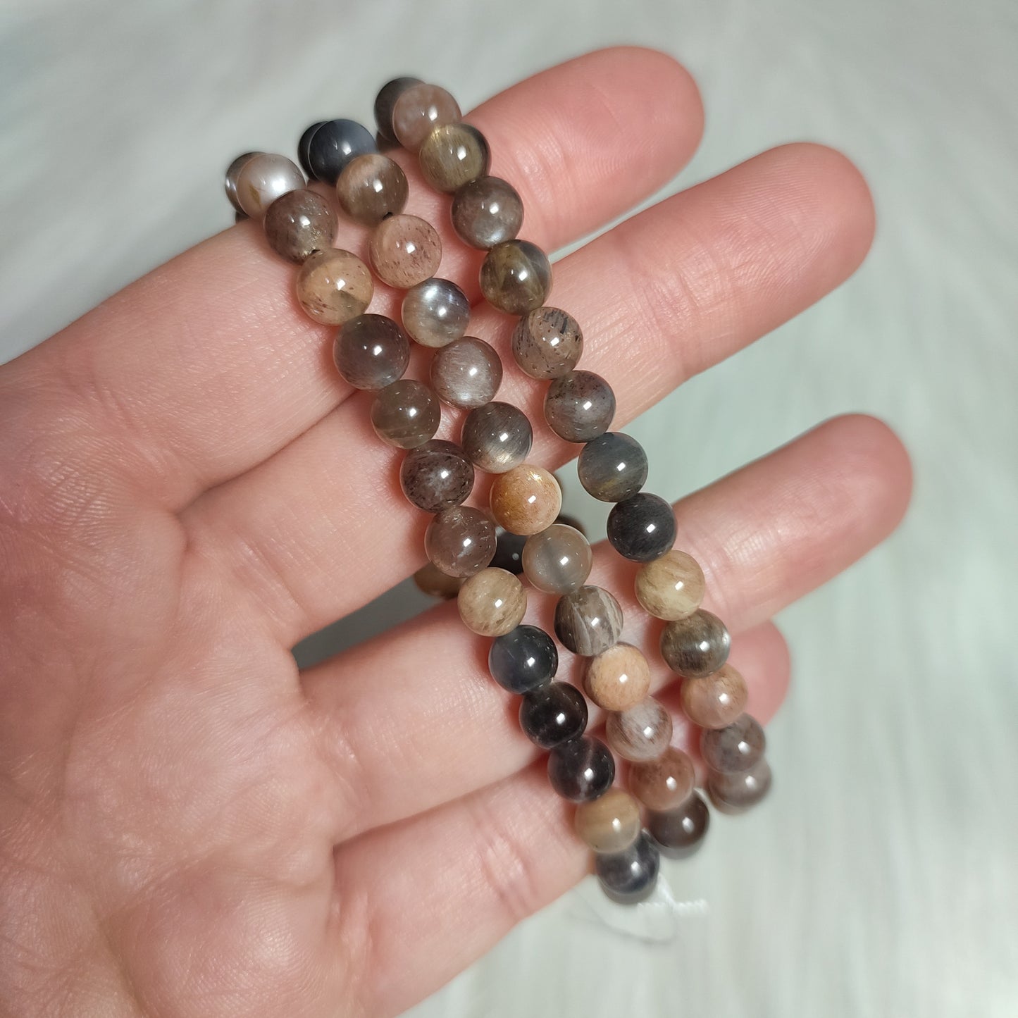 Pulsera elástica esferas de piedra luna mix melocotón/gris