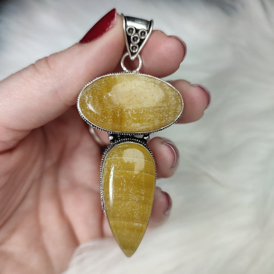 Colgante baño de plata con calcita naranja