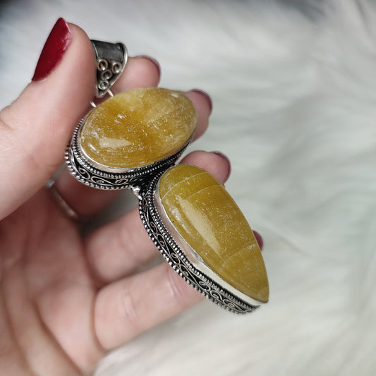 Colgante baño de plata con calcita naranja