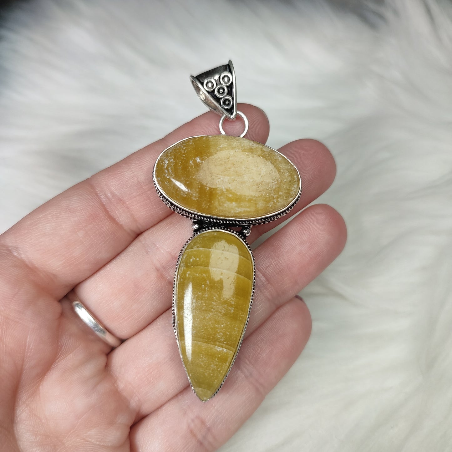 Colgante baño de plata con calcita naranja