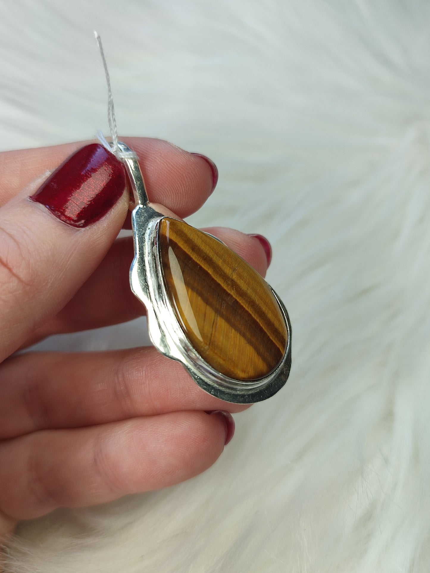 Colgante baño de plata con ojo de tigre