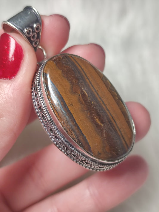 Colgante baño de plata con ojo de tigre con ojo de hierro 314