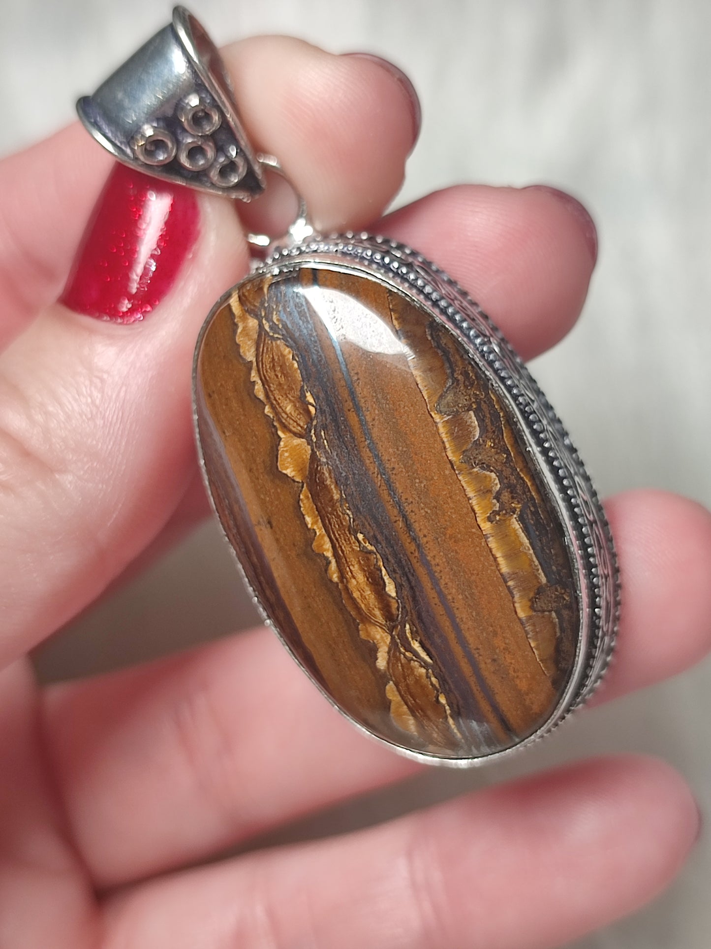 Colgante baño de plata con ojo de tigre con ojo de hierro 314