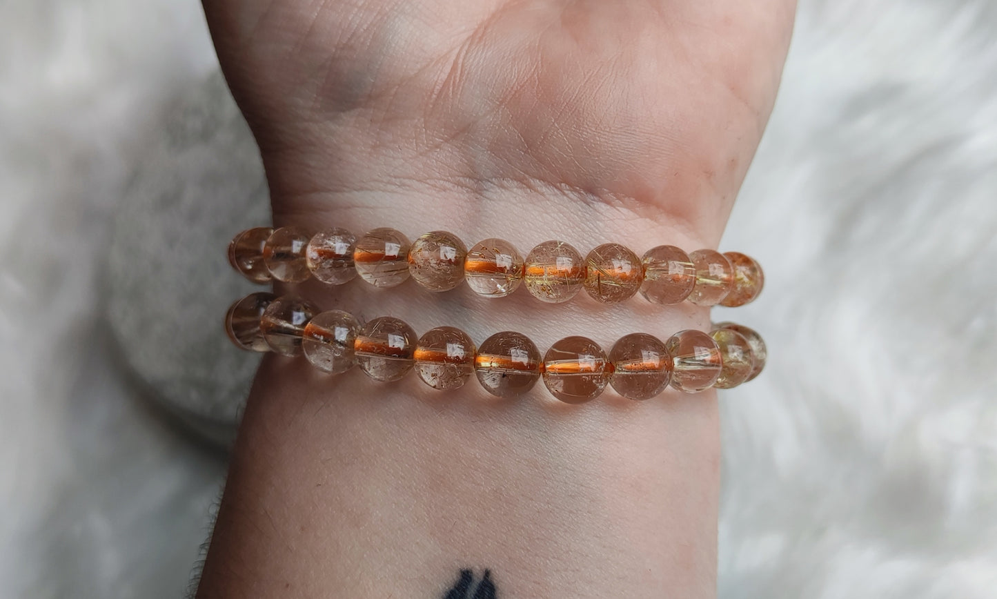 Pulsera elástica esferas cuarzo rutilo - cabello de ángel 7 mm