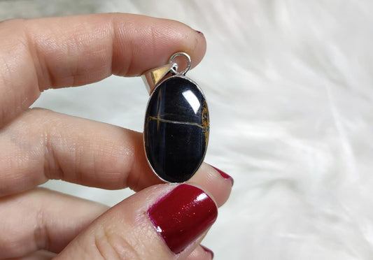 Colgante baño de plata con ojo de halcón