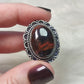 Anillo baño de plata con ojo de  hierro N°25