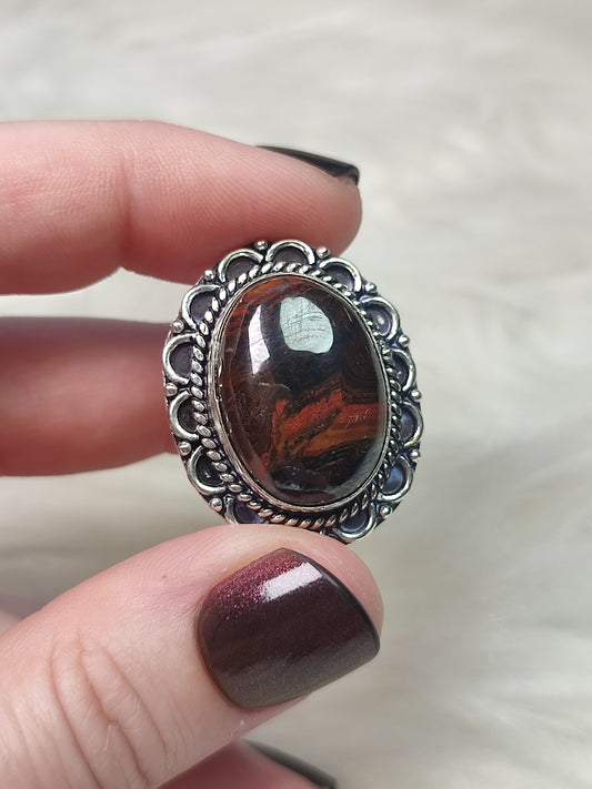 Anillo baño de plata con ojo de  hierro N°25