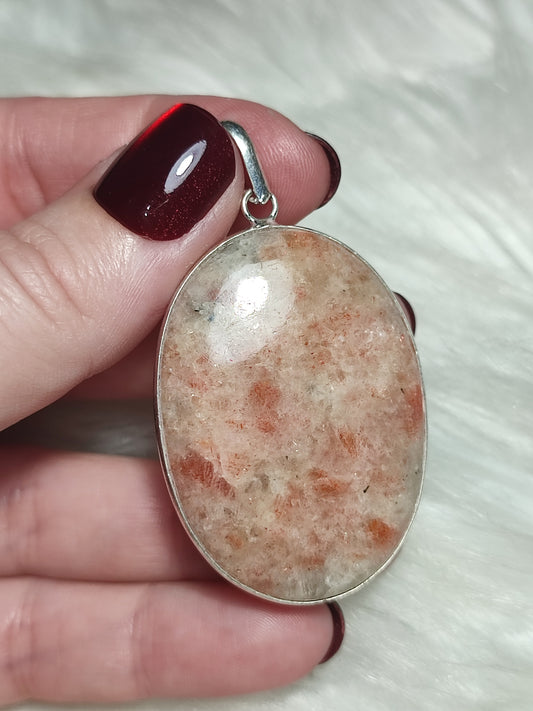 Colgante baño plata con piedra sol n°5