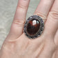 Anillo baño de plata con ojo de  hierro N°25