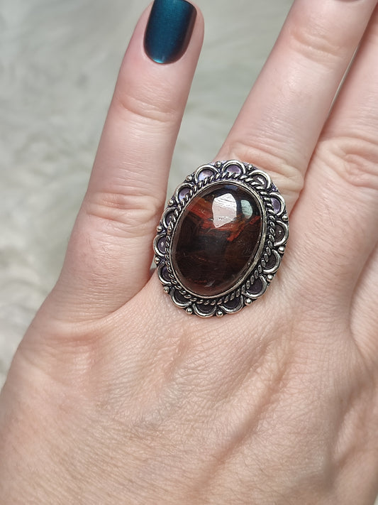 Anillo baño de plata con ojo de  hierro N°25
