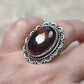Anillo baño de plata con ojo de  hierro N°25