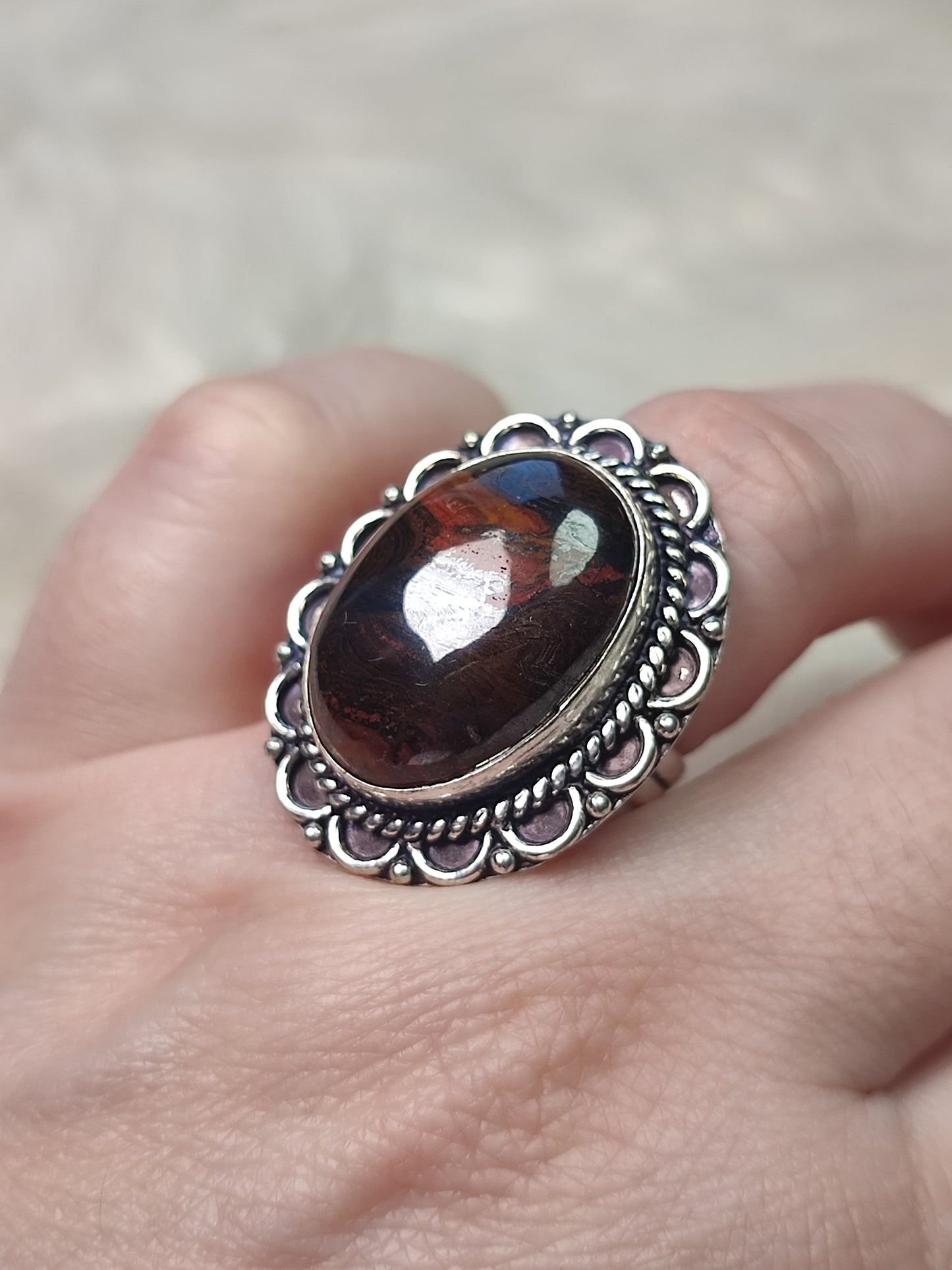 Anillo baño de plata con ojo de  hierro N°25