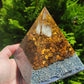 Orgonita funcional Pirámide de ojo de tigre 812 gramos