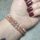 Pulsera elástica bolas 6 mm - Piedra Luna melocotón mix sol